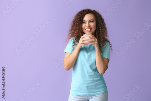 Young woman with tasty yogu...