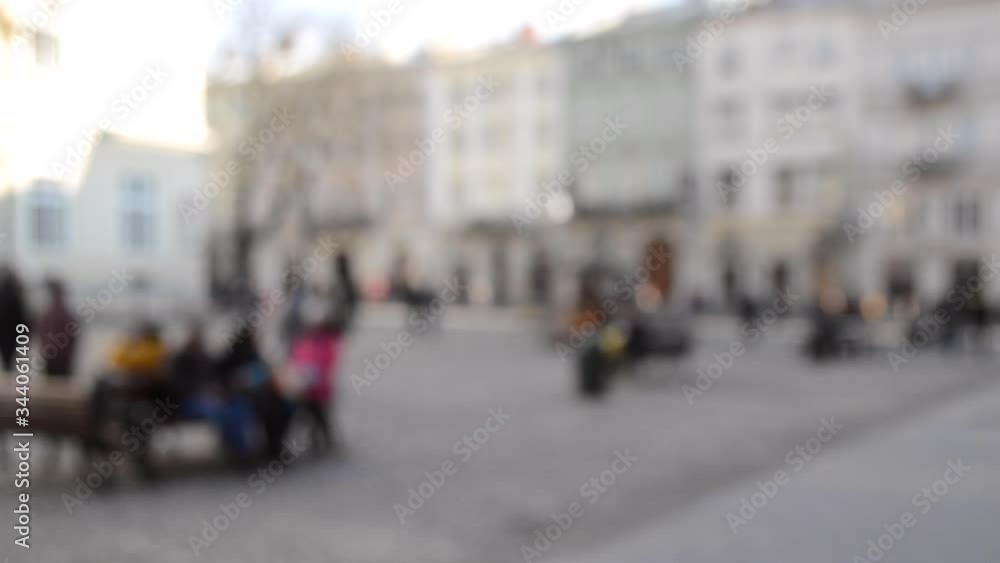 Abstract Defocused Blurred Background of many people on street square Abstract Defocused Blurred Background of many people on street square