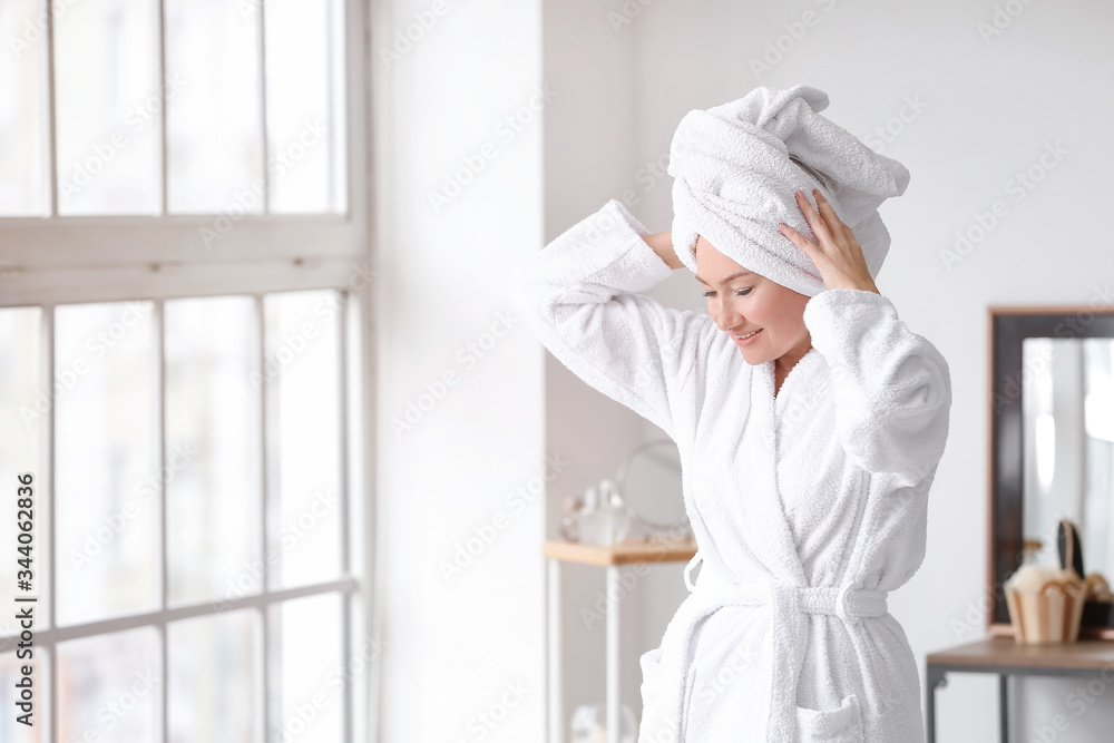 Morning of mature woman in bathroom