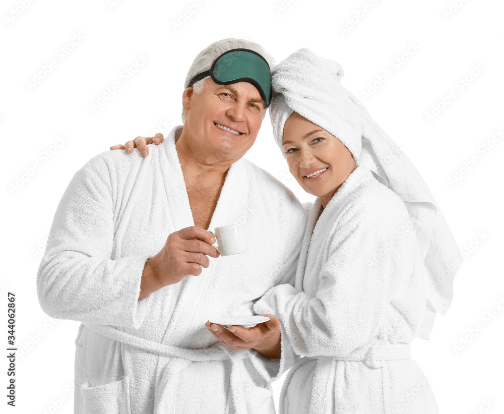 Mature couple in bathrobes on white background Mature couple in bathrobes on white background