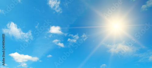 Blue sky. Bright midday sun illuminates the space. Wide photo .