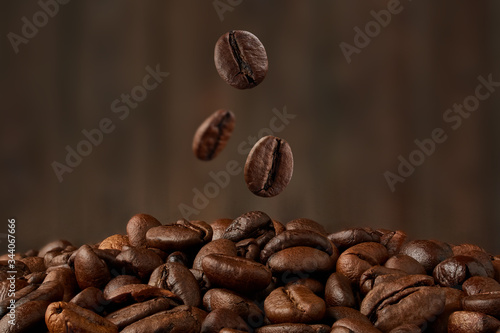 falling coffee beans close up. blurred background