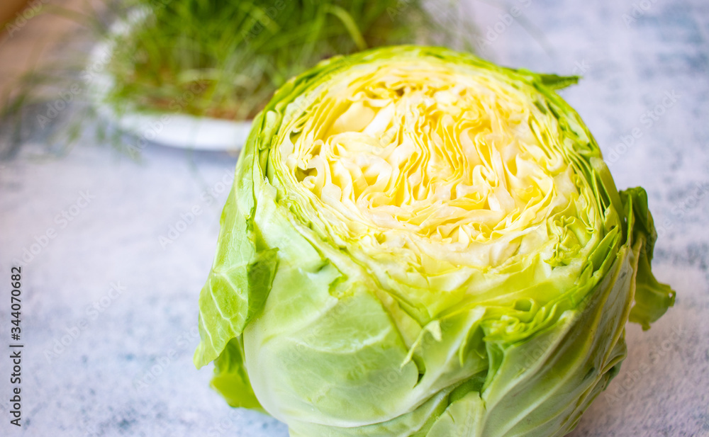 Obraz premium Fresh young green cabbage chopped. Vegan food.