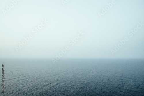 Poetic image of the sea and sky melted by the sea mist.