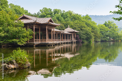Wooden platform and walking path in West Lake gardens in Hangzhou, China