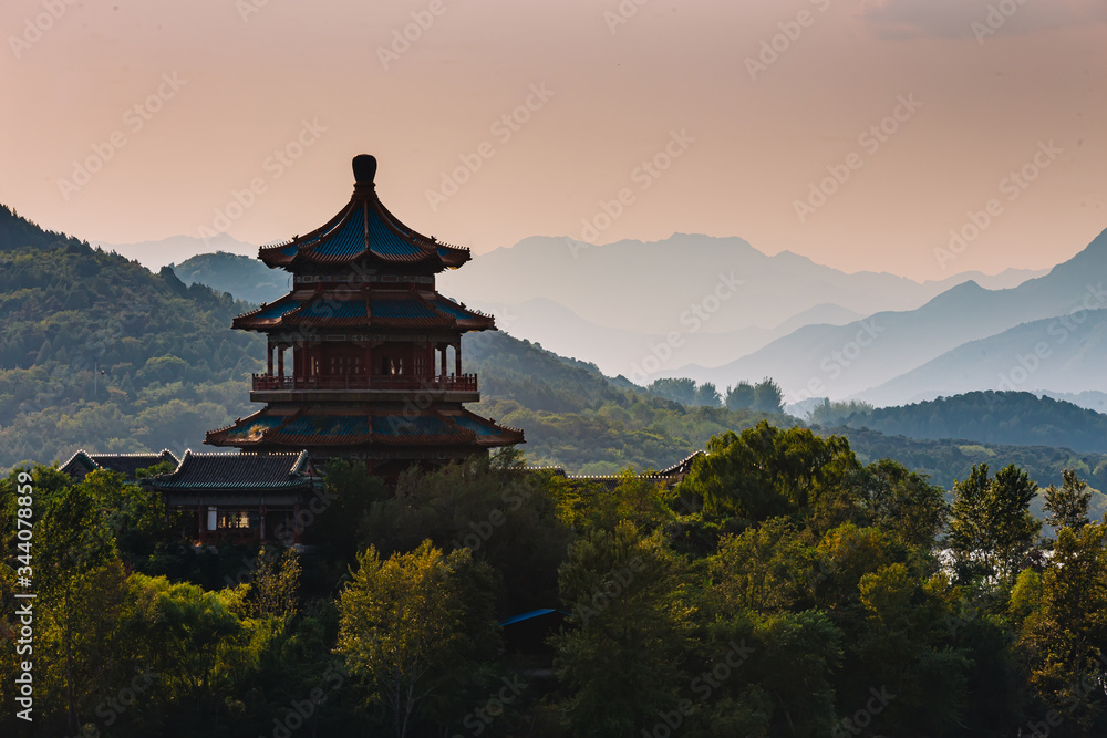 Chinese pagoda on an island, in the middle of water and mountains