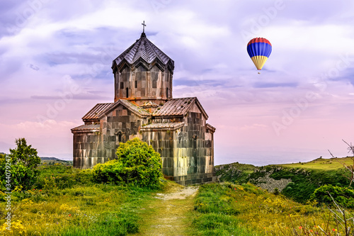 A balloon with the colors of the Armenian flag flies over Amberd Church photo