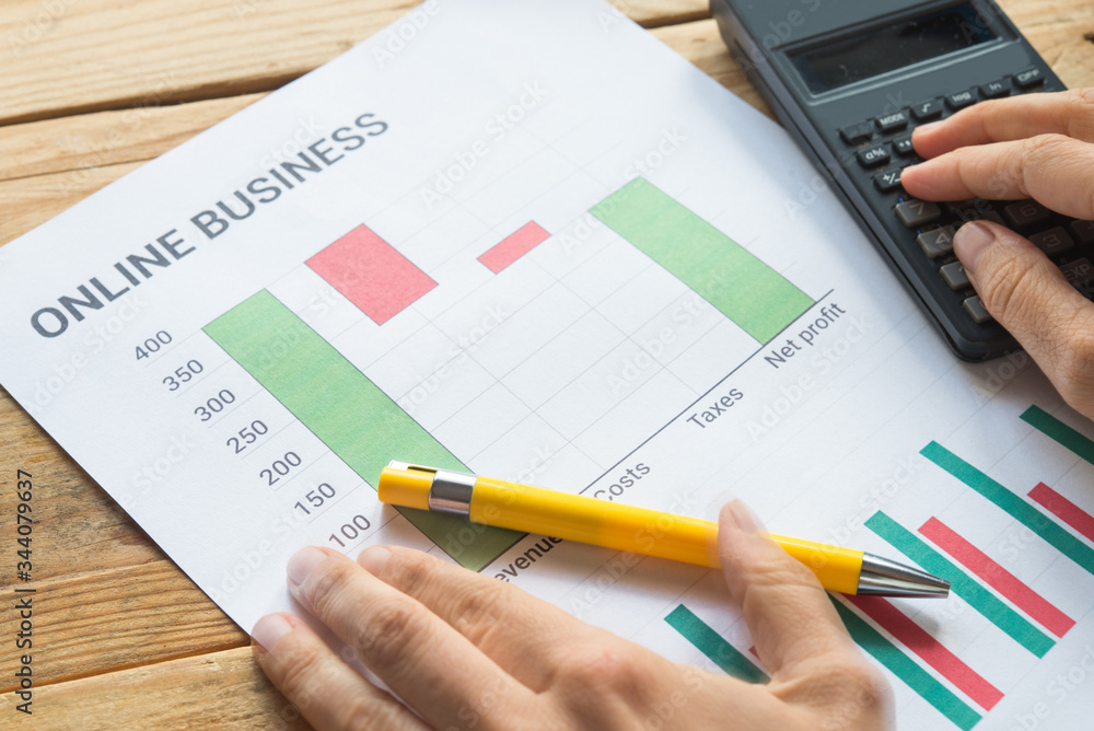 Young business busy working, entrepreneur analyzing financial information as graphics Young business busy working, entrepreneur analyzing financial information as graphics