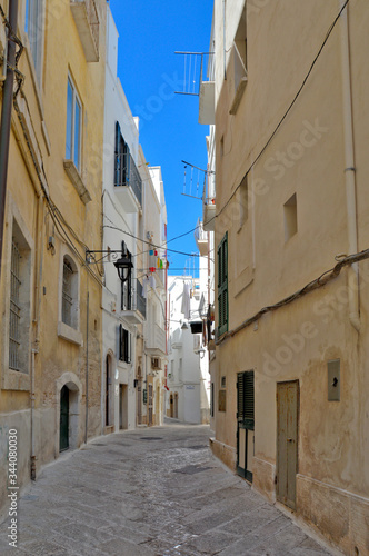 A narrow street in the old town of Monopoli in the Puglia region, Italy.