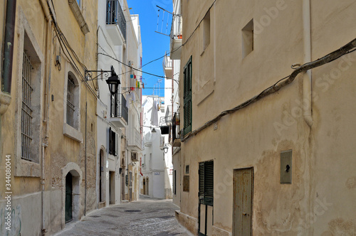 A narrow street in the old town of Monopoli in the Puglia region, Italy. © Giambattista