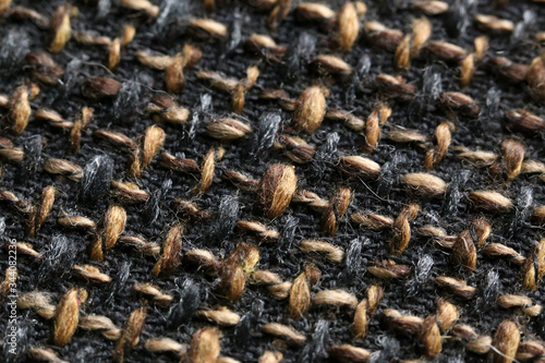 The structure of brown woolen fabric close-up