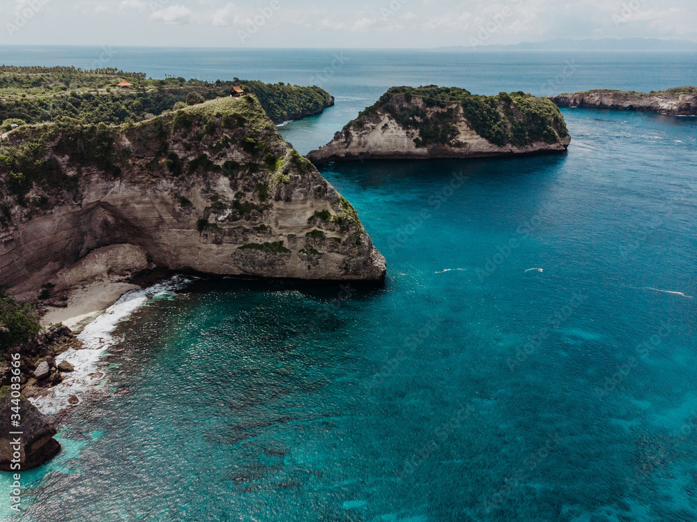 Nusa Penida island aerial view beach from drone. Travel Indoneesia. Aerial top view of the Atuh beach bay in the Nusa Penida island