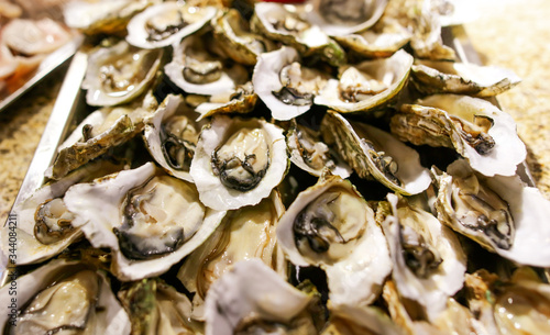 Oysters in shells as a background.