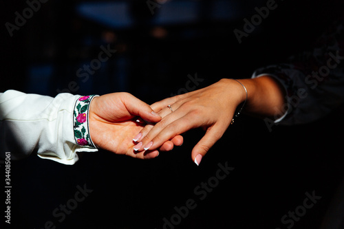 hands with wedding rings at the bride, couple, details