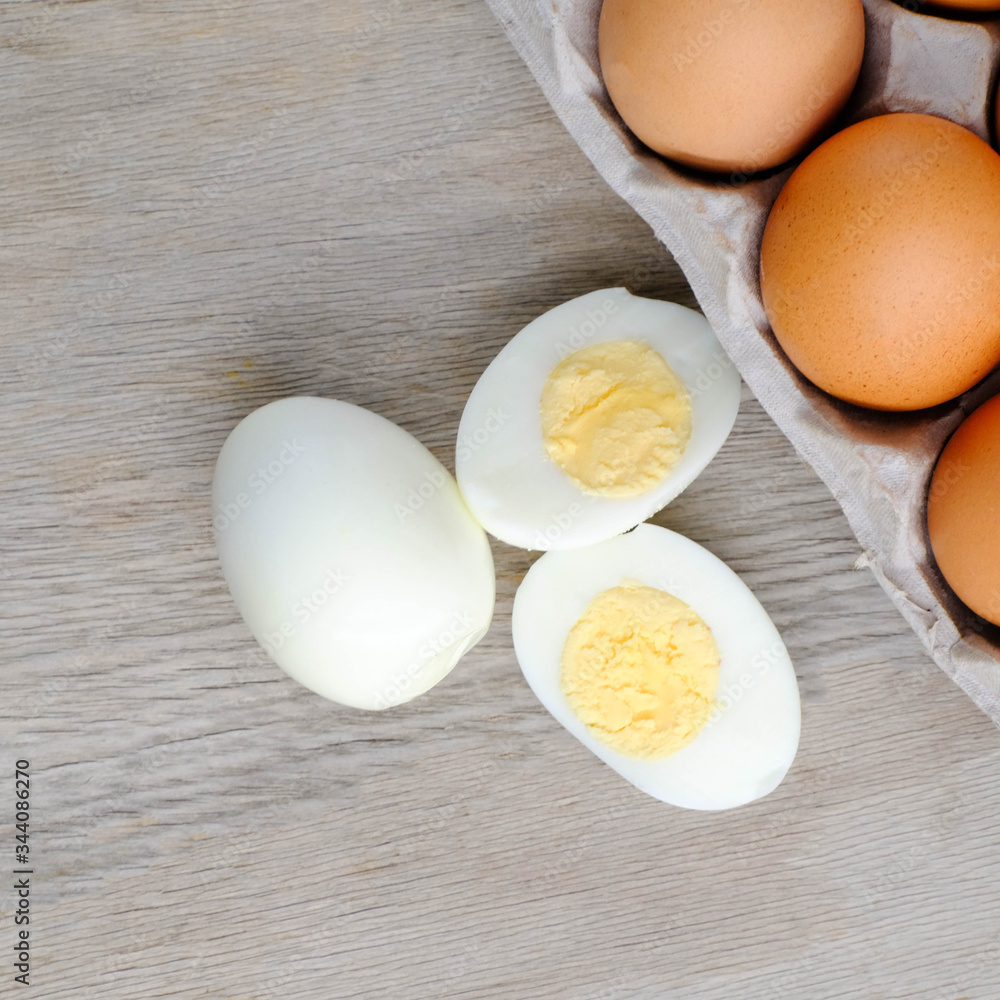 halves of boiled eggs on wooden rustic background. the view from the top
halves of boiled eggs on wooden rustic background. the view from the top