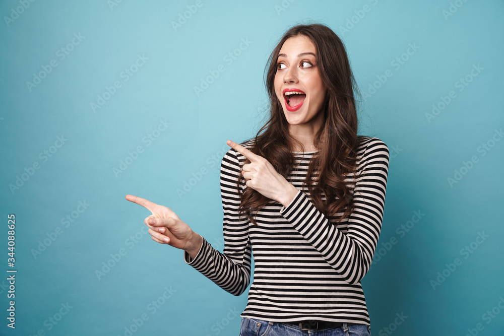 © Drobot Dean - Photo of excited nice woman in striped sweater pointing fingers aside