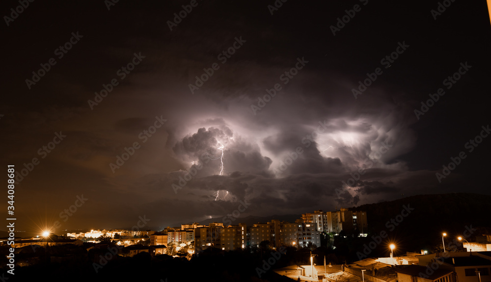 lightning and thunderstorm over the city of iglesias city in southern Sardinia