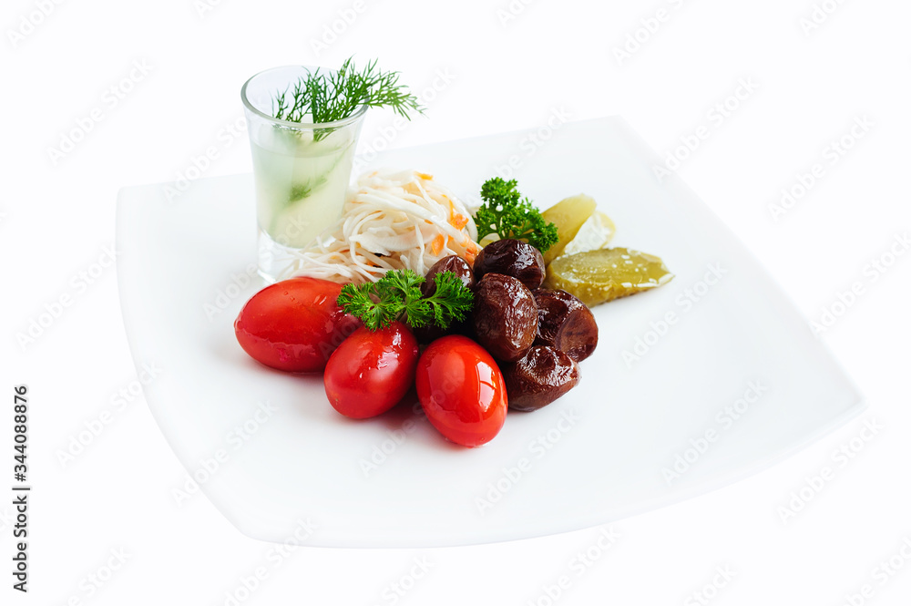 Pickled vegetables - cucumber, tomato and cabbage isolated on white. Preserved food Pickled vegetables - cucumber, tomato and cabbage isolated on white. Preserved food
