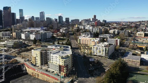 Aerial / drone footage of the International District, Yesler Park with construction on hold, empty streets in Yesler Terrace and downtown Seattle, Washington during the COVID-19 pandemic