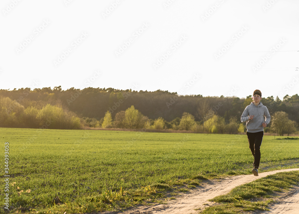 young man running in the field