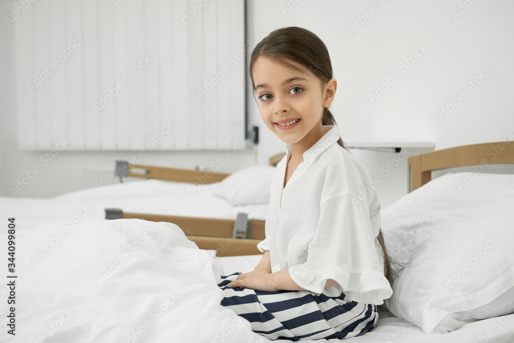 Smale female patient sitting on couch. Smale female patient sitting on couch.