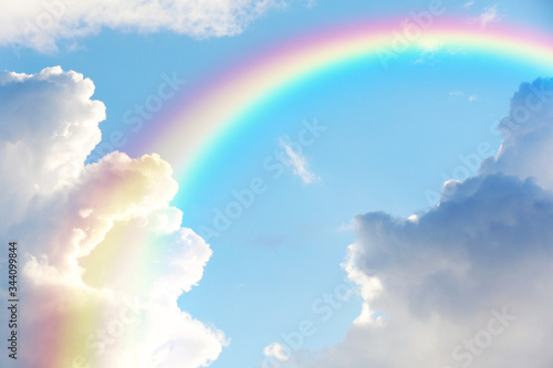 Picturesque view of beautiful rainbow and blue sky on sunny day photo