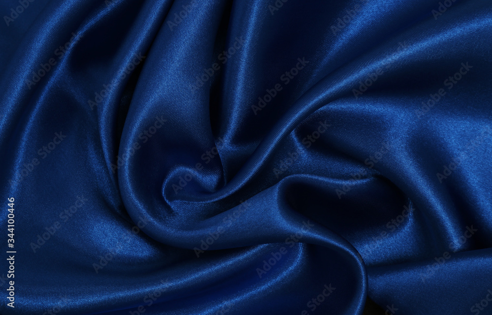 Fototapeta premium Smooth elegant blue silk or satin luxury cloth texture as abstract background. Luxurious Christmas background or New Year background design