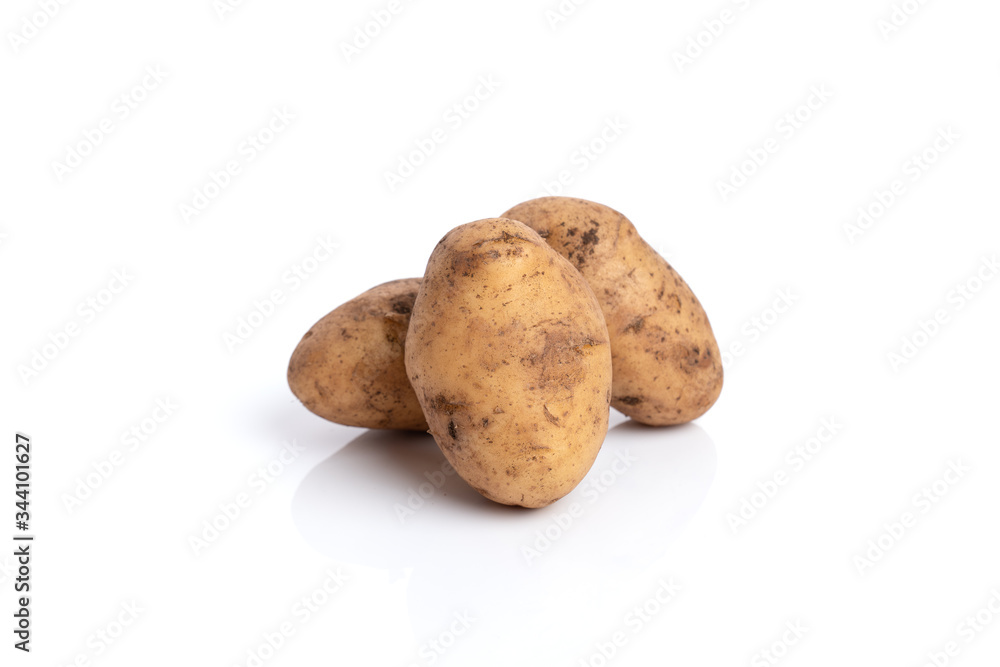 Three potatoes isolated on a white background. Root vegetable. Three potatoes isolated on a white background. Root vegetable.