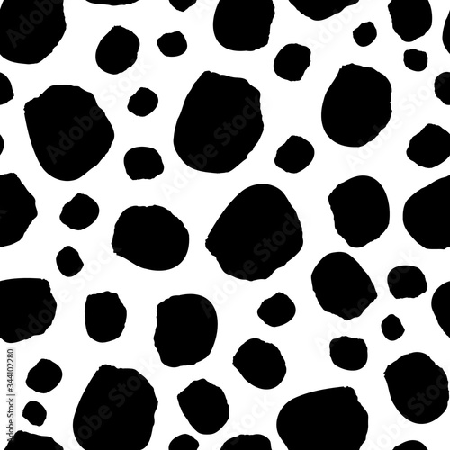 Black spots on white background seamless vector pattern. Abstract background with round brush strokes. Monochrome hand drawn texture.