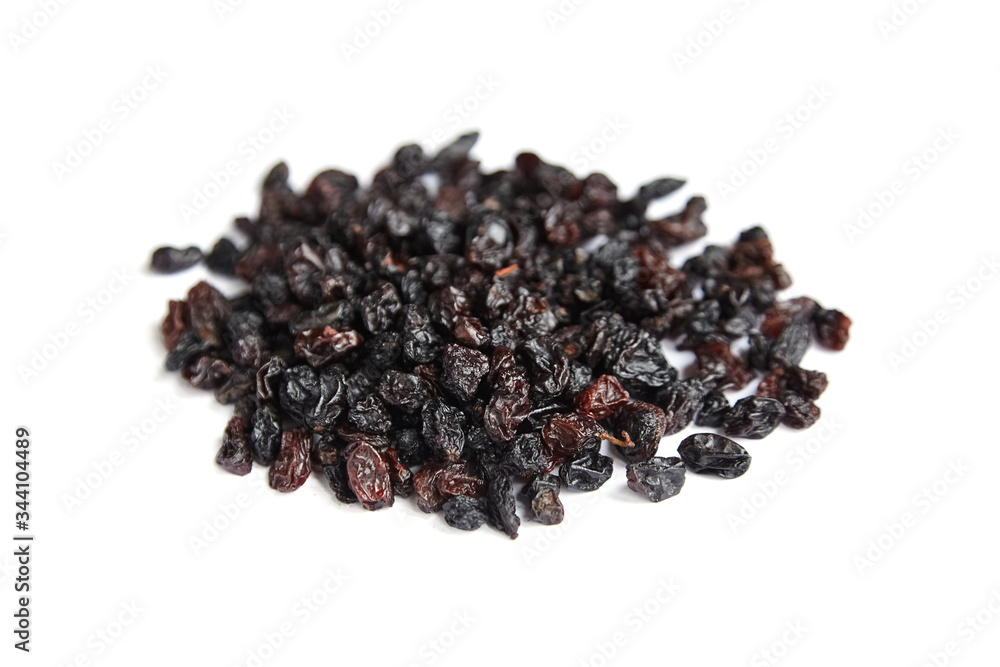 Raisins isolated on white background. Heap of dried red grapes Raisins isolated on white background. Heap of dried red grapes