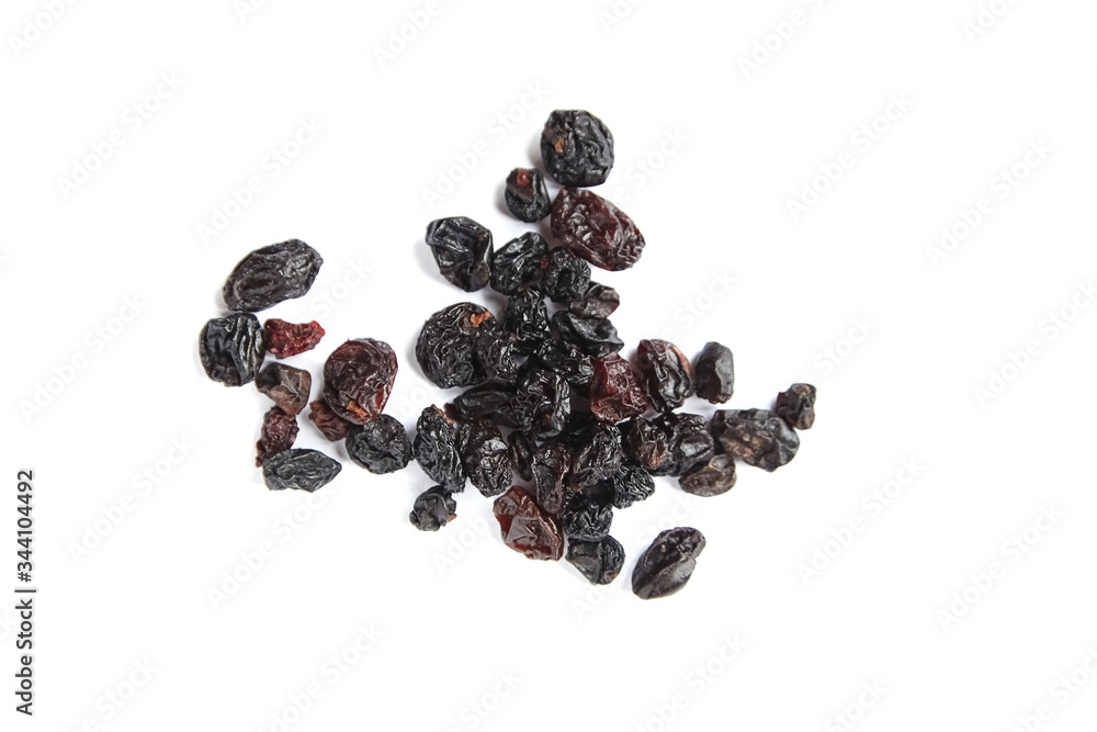 Raisins isolated on white background. Heap of dried red grapes Raisins isolated on white background. Heap of dried red grapes