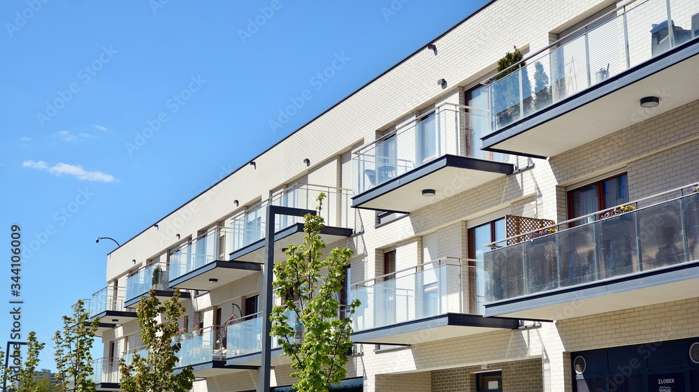 Obraz premium Residential Building on sky background. Facade of a modern housing construction with of balconies.