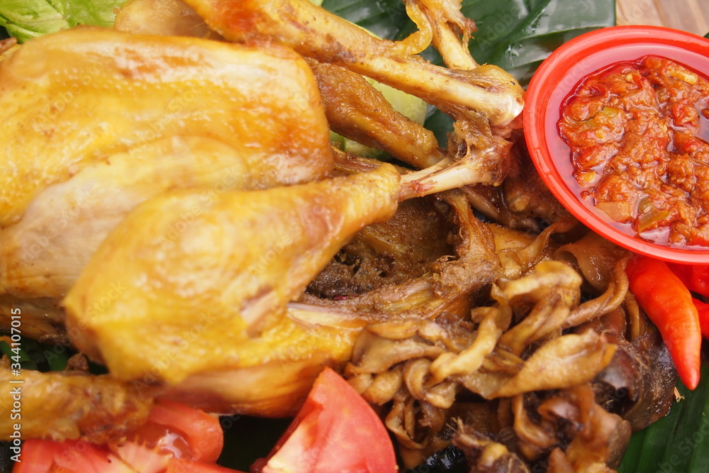 Java ingkung chicken. Indonesian favorite fried chicken with spices. Java ingkung chicken. Indonesian favorite fried chicken with spices.