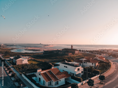 Wallpaper Mural The Farol de Esposende (Esposende Lighthouse) set in front of the Fort of Sao Joao Baptista de Esposende. The two sides of Restinga de Ofir. One facing the ocean, the other the estuary of Cávado River Torontodigital.ca
