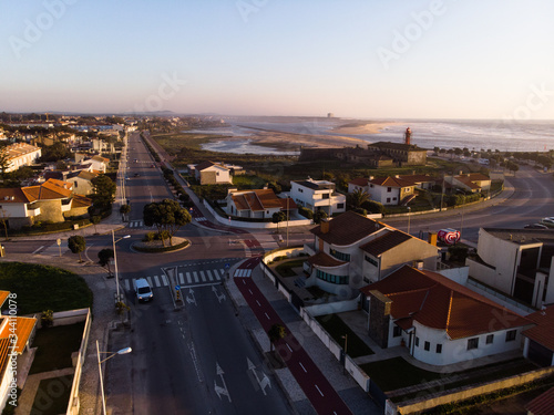 The marginal riverside, along the mouth of the Cavado River at sunset in Esposende, Portugal. The two sides of Restinga de Ofir. One facing the ocean, the other the estuary of Cávado River.
