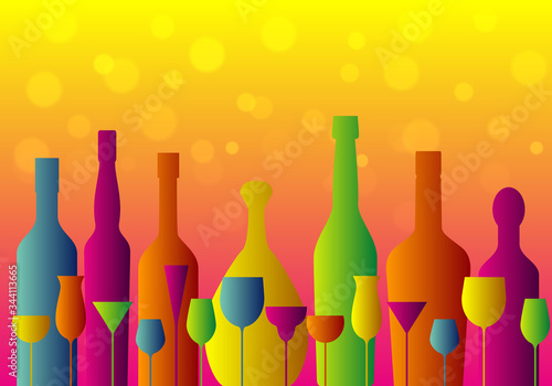 set of colorful cocktail glasses and bottles on orange background