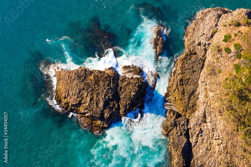 Drone Shot of Waves Breaking on Rocks in the Ocean