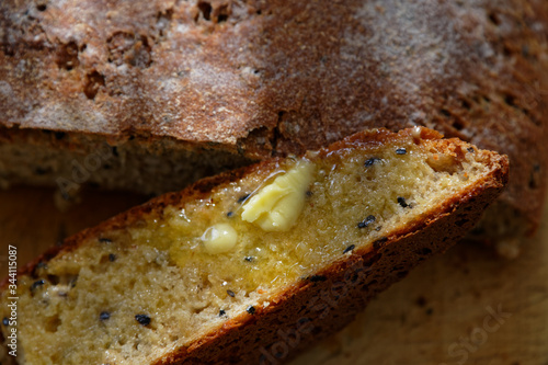 Wallpaper Mural A slice of freshly baked bread with butter melting on it Torontodigital.ca