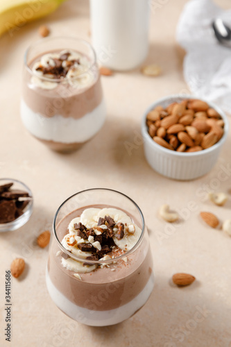 Chia seeds pudding with chocolate and banana smoothie in a glass