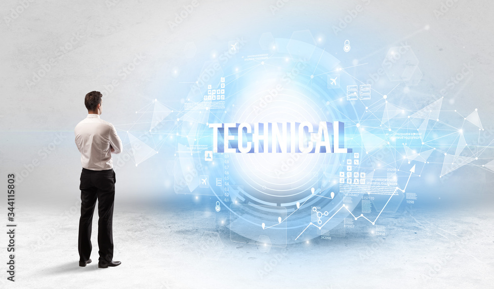 Rear view of a businessman standing in front of TECHNICAL inscription, modern technology concept Rear view of a businessman standing in front of TECHNICAL inscription, modern technology concept