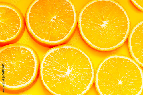 Fresh orange citrus fruits on a yellow background. Fruits modern image. Flat lay. Top view. Pop art style. Creative minimalism.
