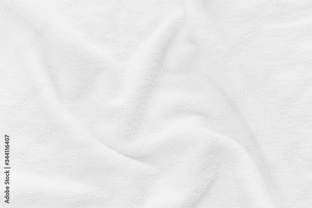 Close-up of white fabric texture background. Abstract crumpled cloth. Close-up of white fabric texture background. Abstract crumpled cloth.