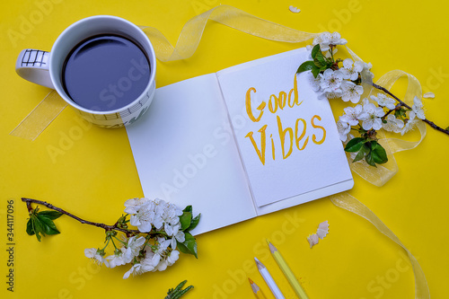 Good Vibes inspirational life motivate concept background. Lay flay. Yellow background photo