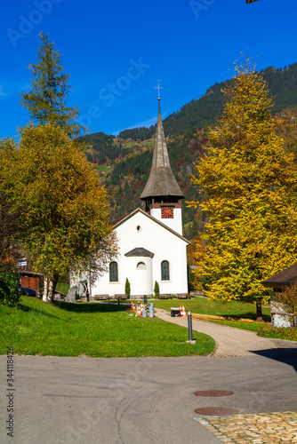 Lauterbrunnen Valley in Alps mountains and church, Berner Oberland
