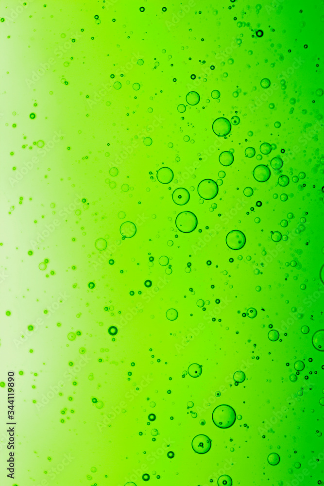 green abstraction of oil drops, background