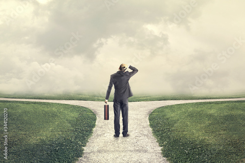 Vászonkép indecisive man and lost chooses the right path