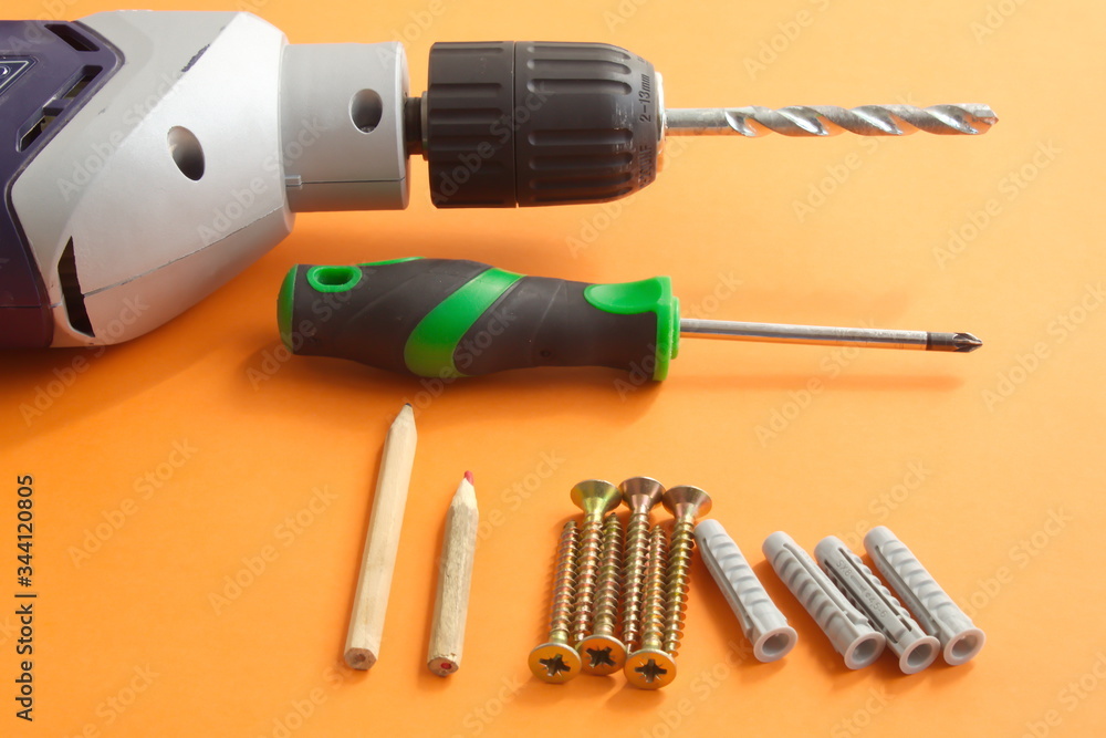DIY tool set consisting of screws, dowels, screwdriver and drill DIY tool set consisting of screws, dowels, screwdriver and drill