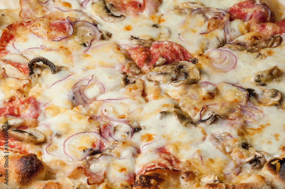 cooked pizza with cheese close-up
