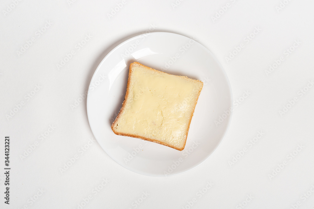 slice of wheaten bread spreaded with butter