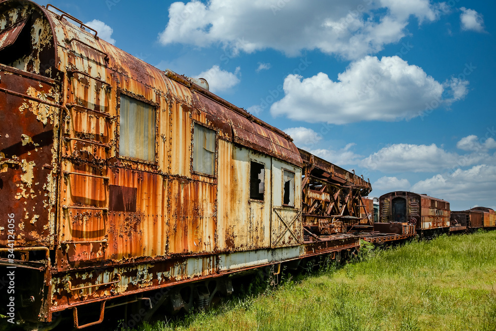 An old abandoned railroad train on tracks An old abandoned railroad train on tracks
